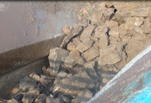 Blasted grey granite to be fed into a jaw crusher